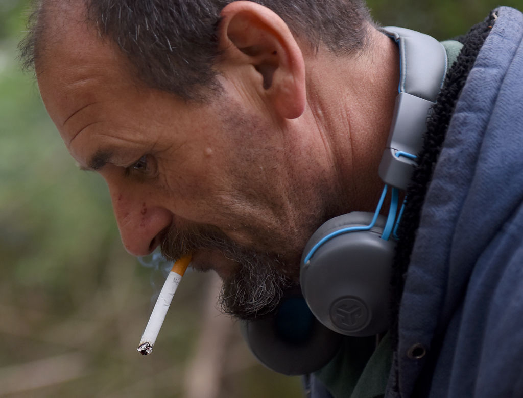 Bobby Hall smokes a cigarette